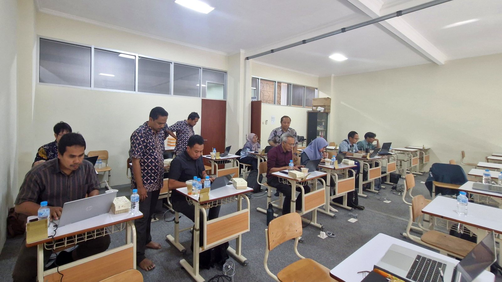 Participants deploying and configuring LLMNetOps on their own laptops during the hands-on session